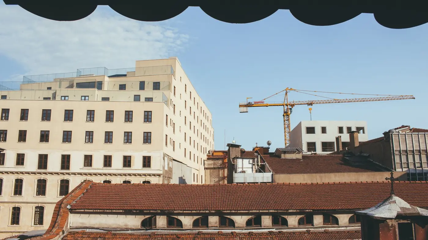 Tower crane above buildings in a city